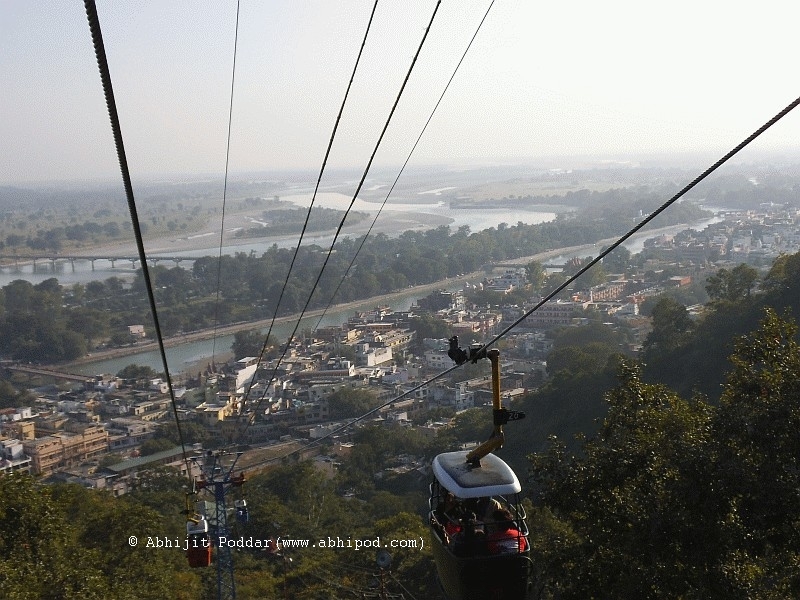 Riding atop a cable car on the way to the Ma Mansa temple 